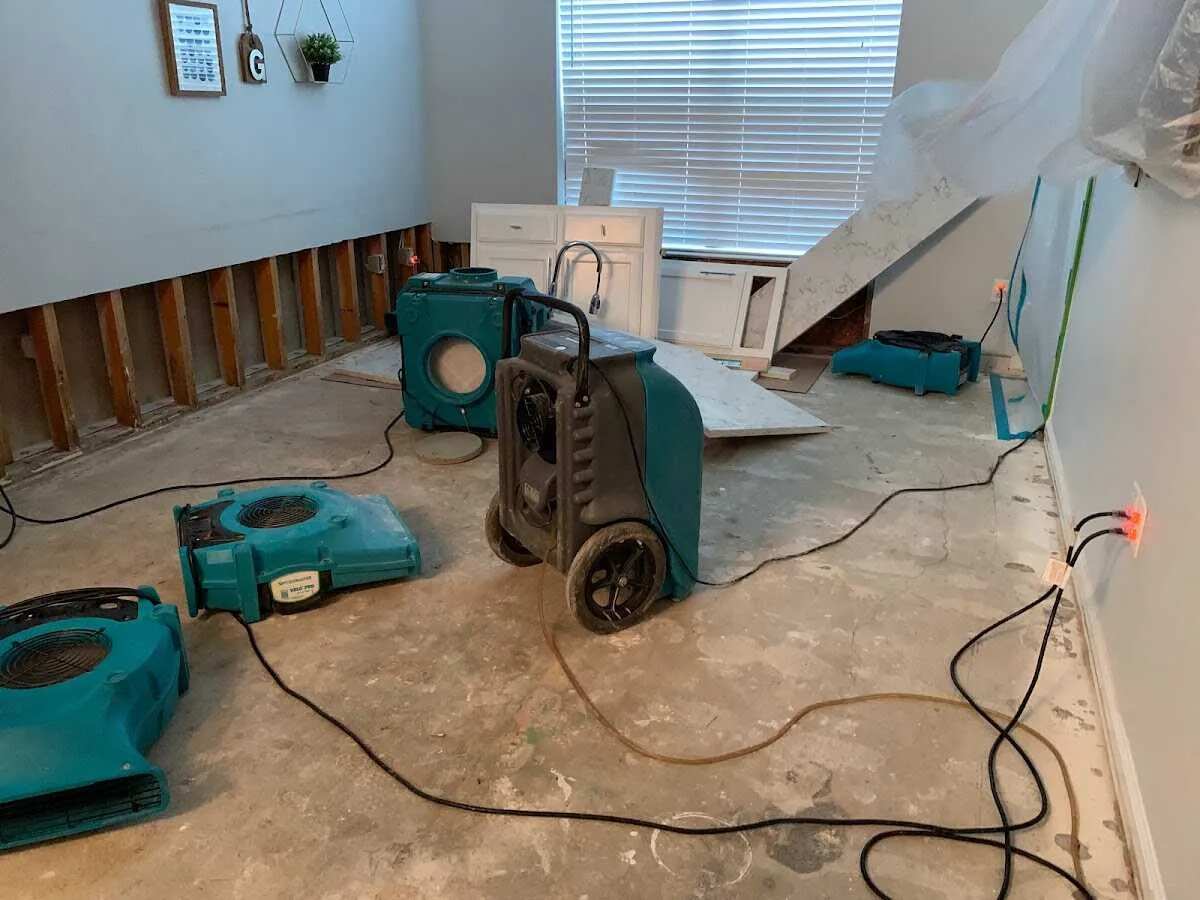 Dehumidifier in flood-cut room for Water Damage Restoration in Tiverton